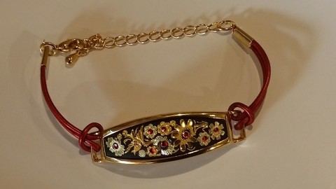 GOLD BRAZALET AND RED ENAMEL